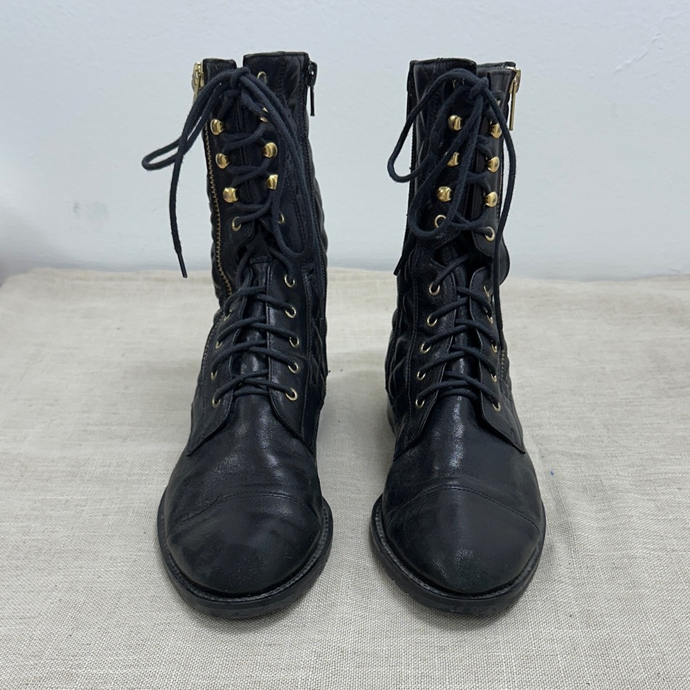 Black Lace-Up Boots with Gold Accents
New